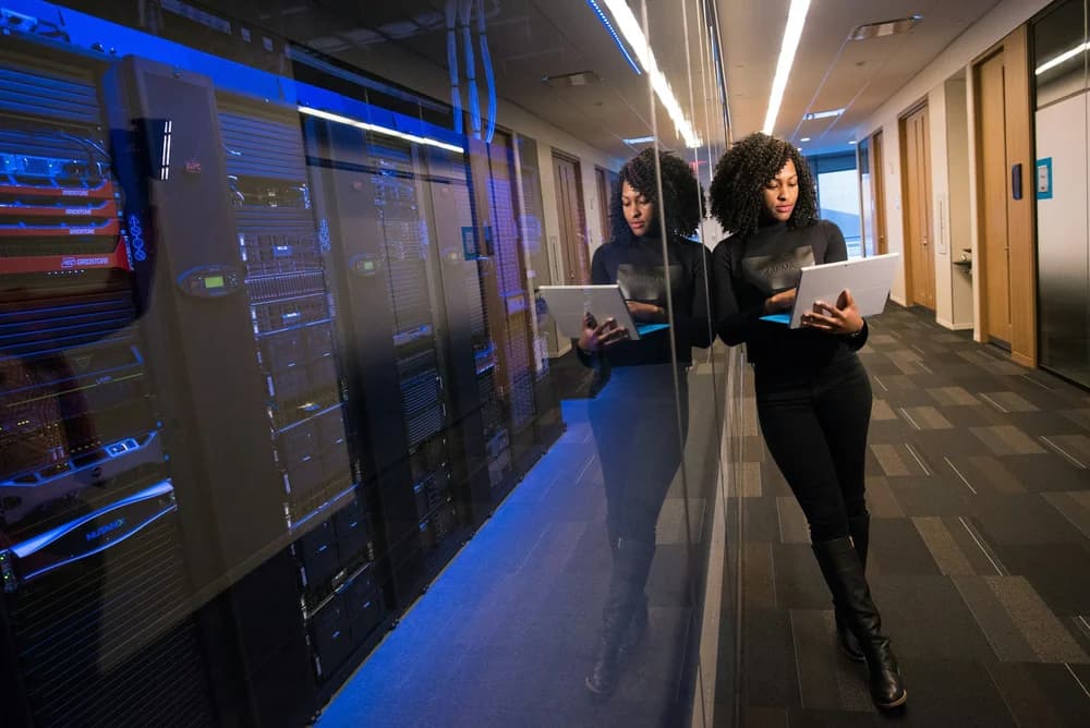 Sepheid team member reviewing work in a server room