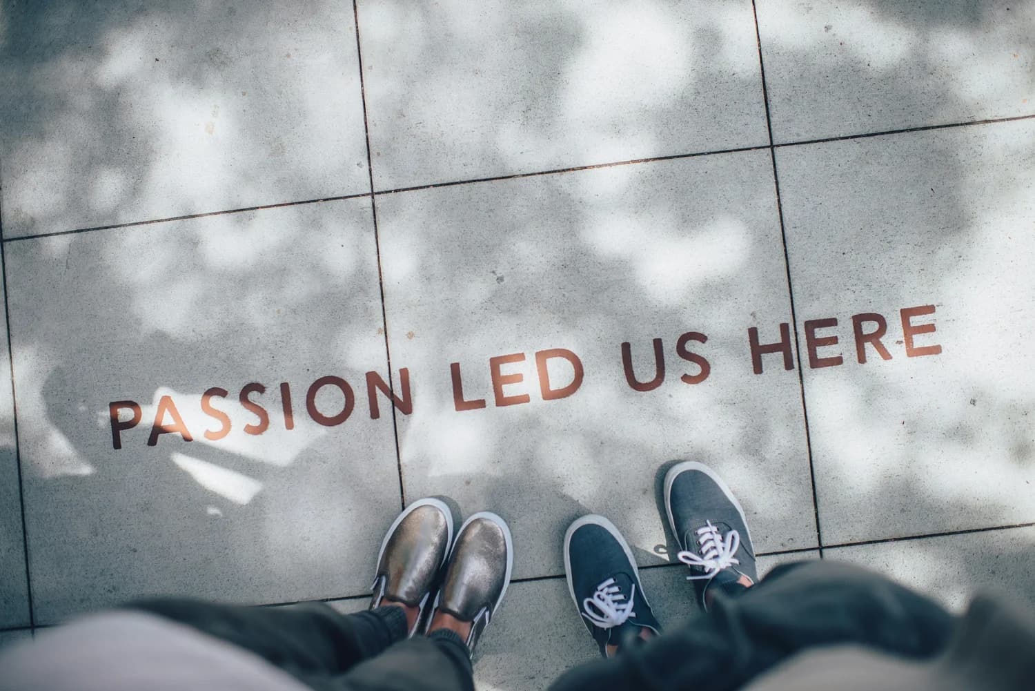Passion led us here, painted on a sidewalk